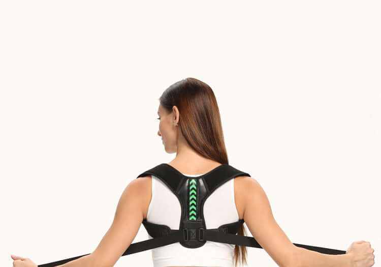 Person wearing a black posture corrector on a white background