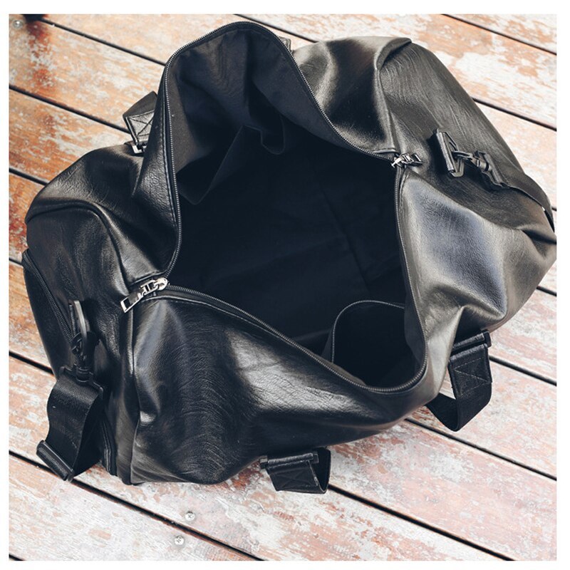 Interior view of a waterproof sports gym bag, showcasing its spacious black PU leather design.
