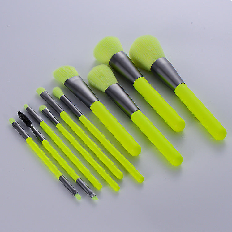 professional neon makeup brushes set featuring bright fluorescent green bristles and wooden handles.