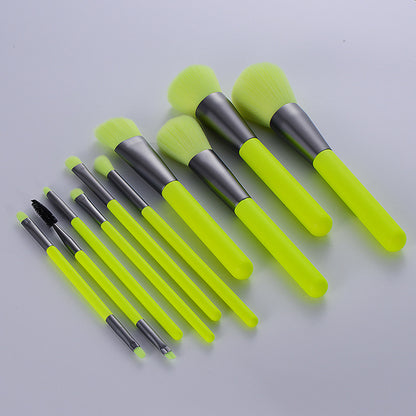 professional neon makeup brushes set featuring bright fluorescent green bristles and wooden handles.