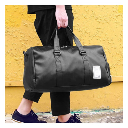 Waterproof sports gym bag held by a person, showcasing its stylish and durable design against a vibrant background.