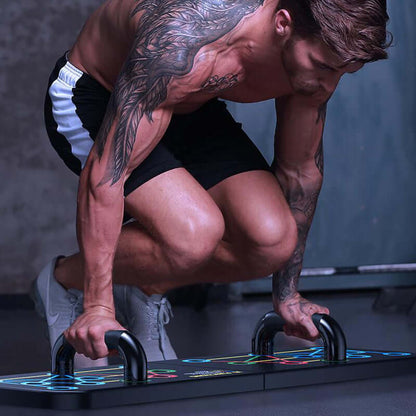 Athlete performing push-ups on a colorful platform with tattoos visible